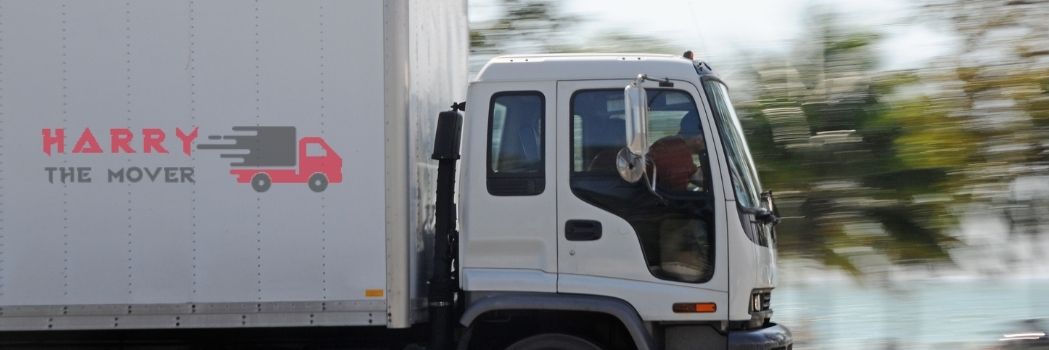 Harry The Mover's moving truck in Melbourne on the road, ensuring safe and reliable transportation for a seamless relocation experience.
