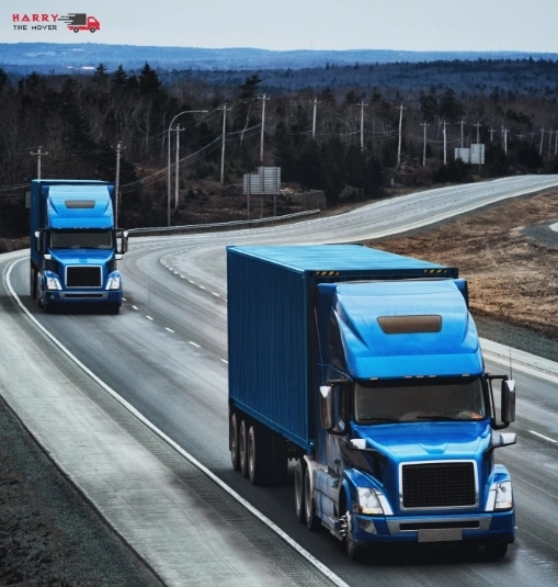 Blue moving trucks on highway showing cost-effective move from Melbourne to Canberra. Blue moving trucks on highway showing cost-effective move from Melbourne to Canberra.