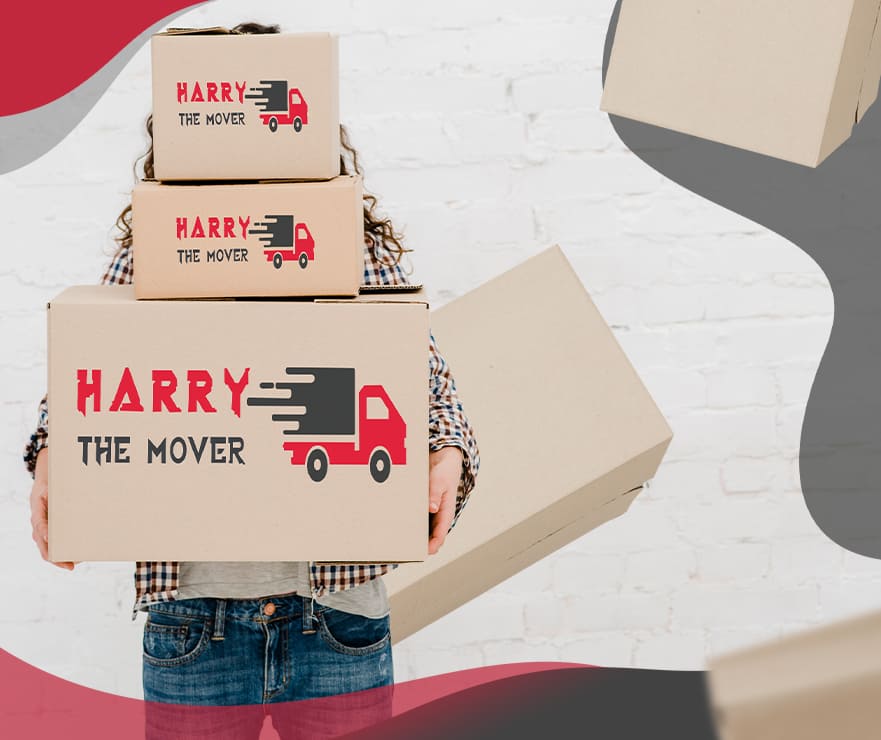 Person holding stacked moving boxes from Harry The Mover showcasing careful packing, secure handling, and professional furniture relocation services for safe house moves in Melbourne.